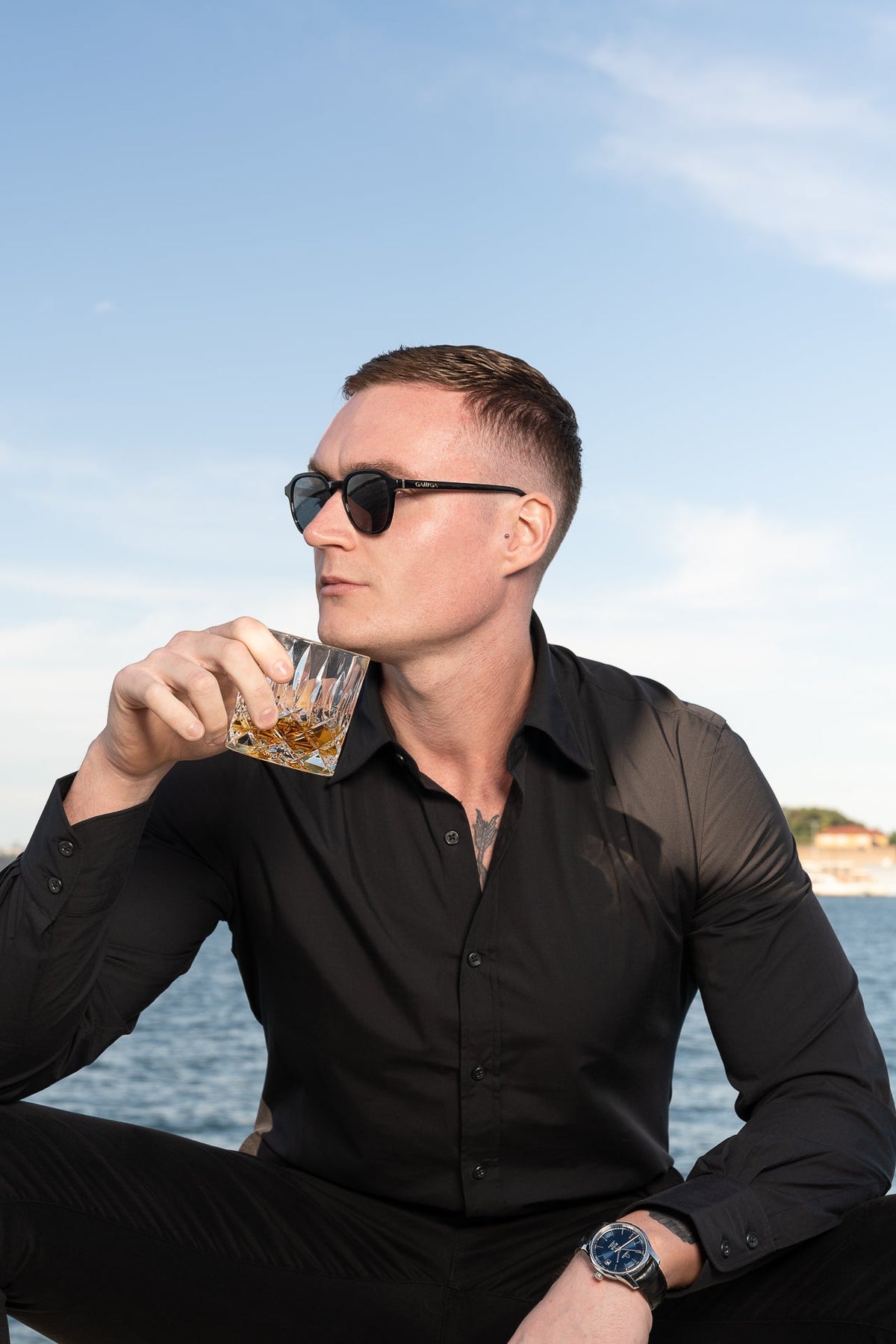 Man wearing GALLIGA sunglasses on a yacht